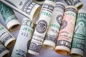 Rolled-Up Ten, Twenty, and One-Hundred Dollar Bills | What Is the Cost of Divorce in NJ?